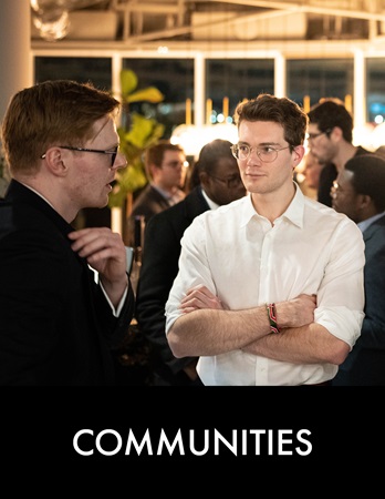 Two men talking at social event