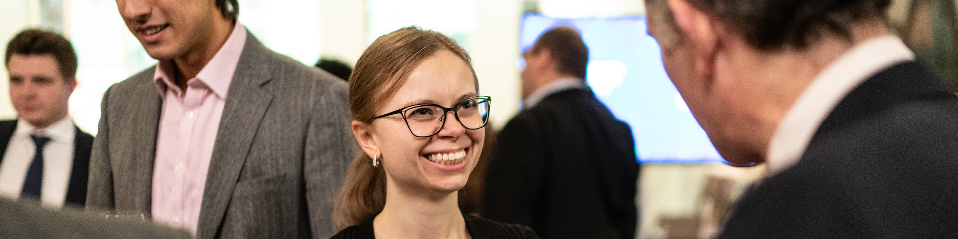 Woman smiling talking to man