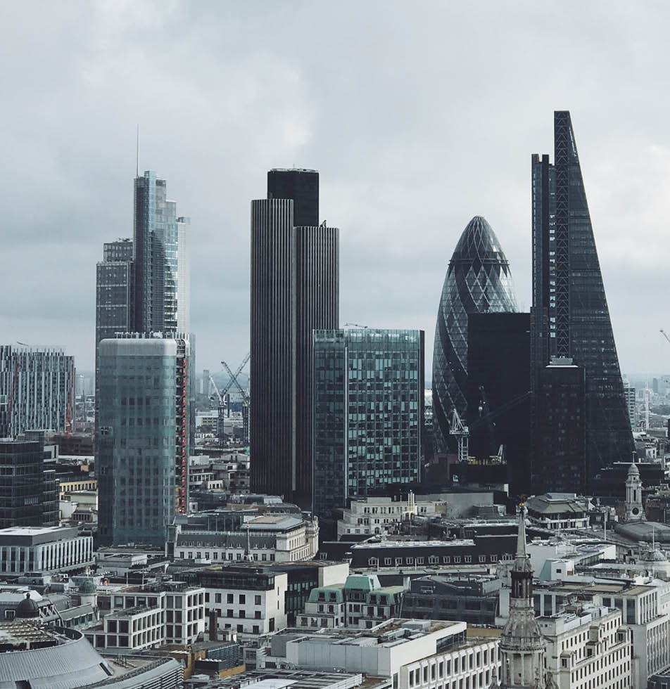 View of London city skyscraper surrounded by grey clouds