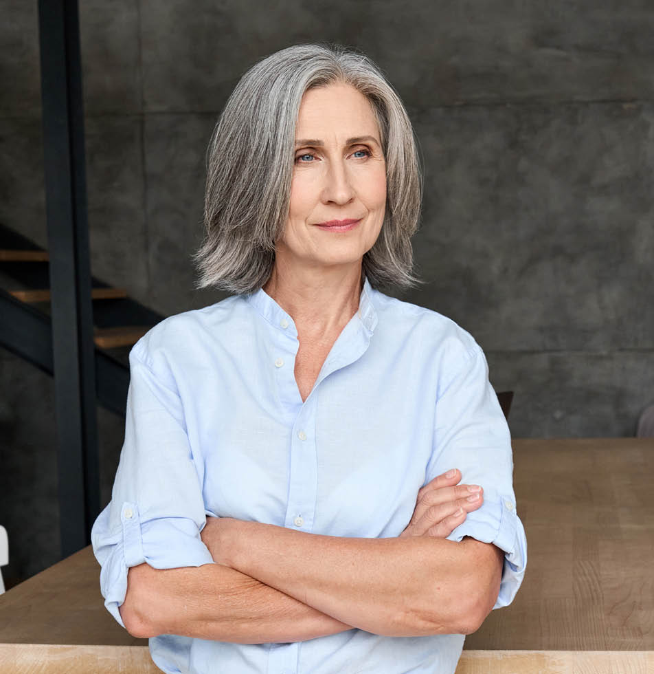 woman smiling whilst arms are crossed 